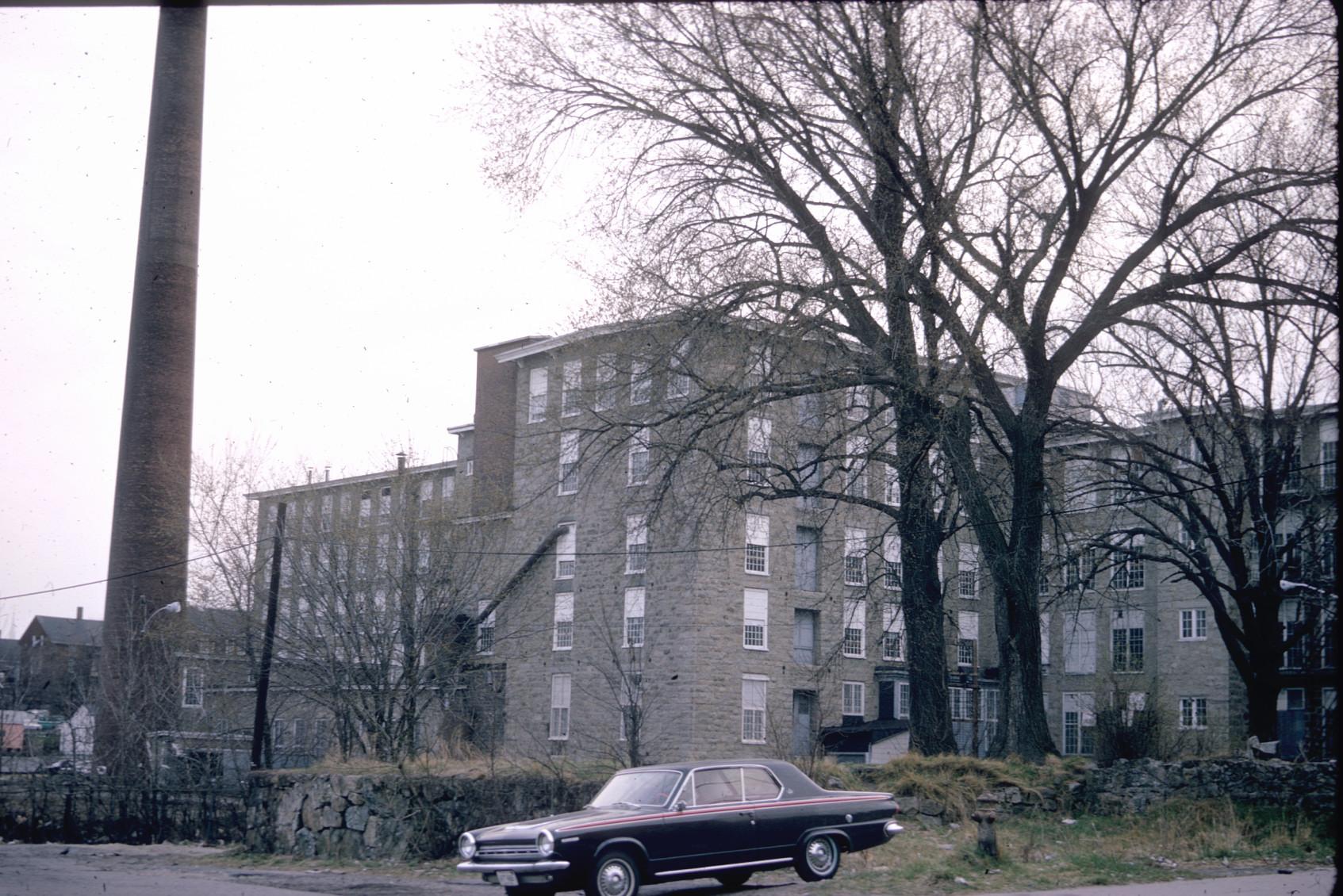 View of front of the Laurel Lake Mills.  Large stack visible.