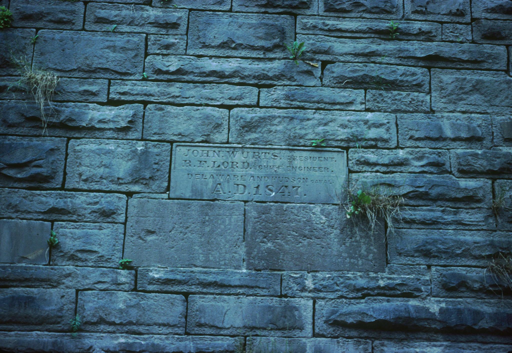 Photograph of date stone of Delaware Aqueduct.  Located on the New York…