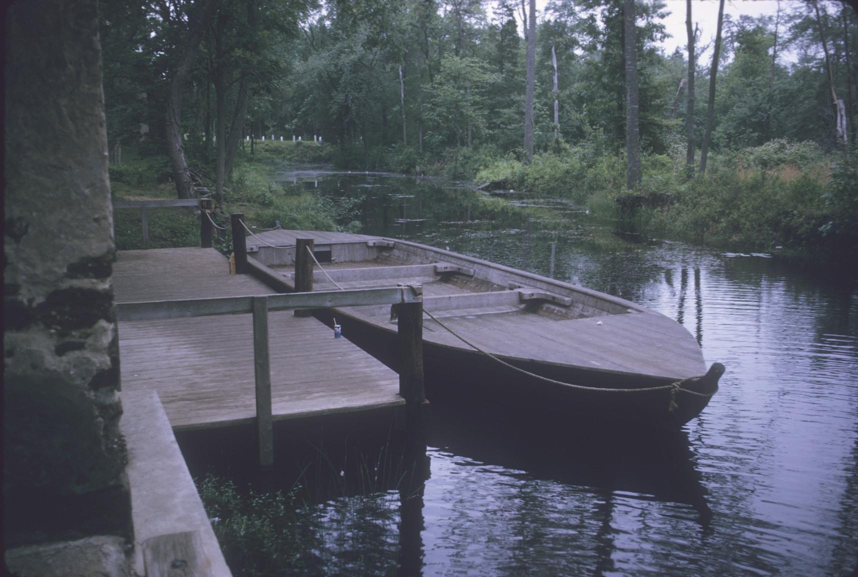 Reproduction of an ore barge at dockside, Batsto Village