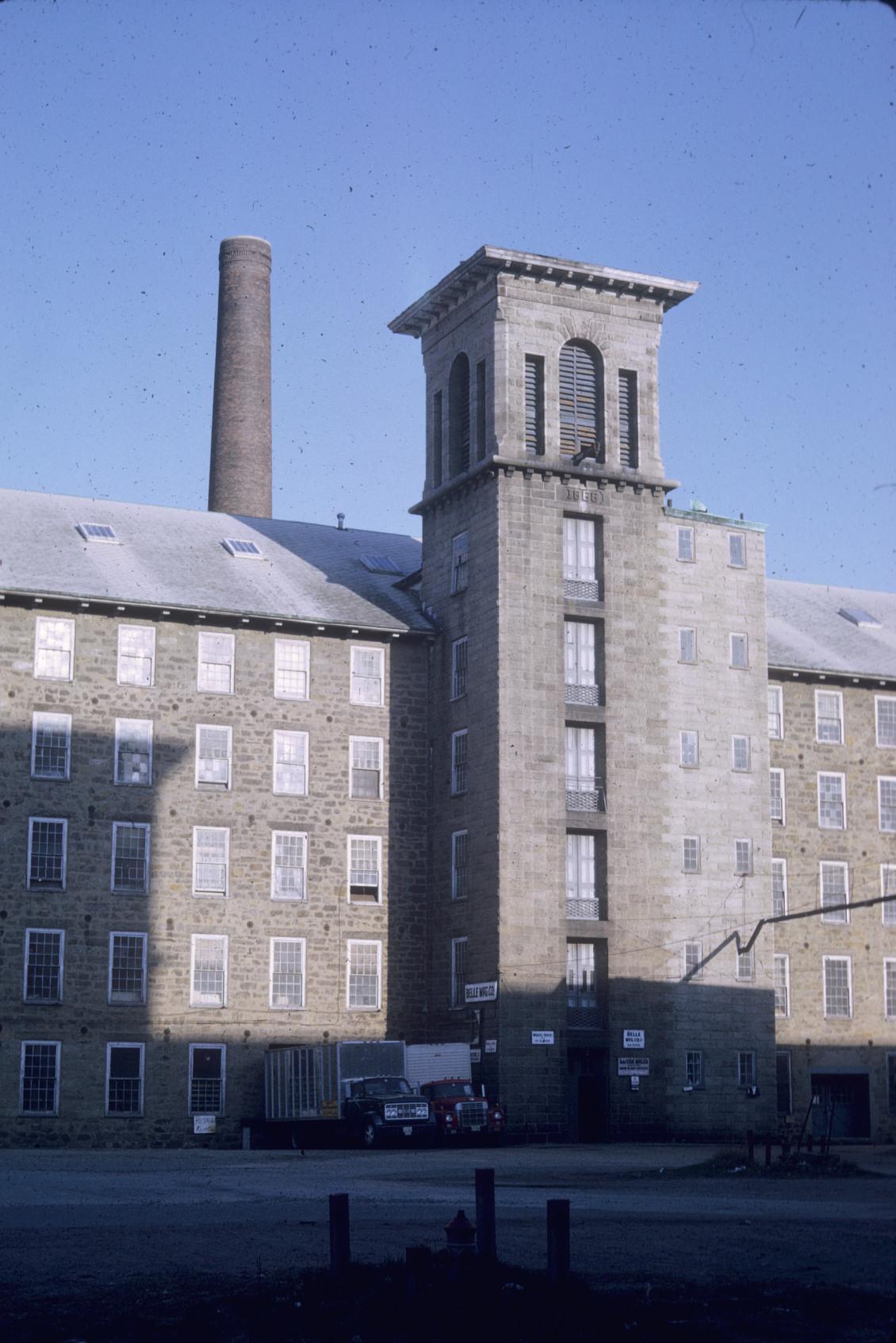 View of front of Durfee Mill No. 1.  Stack and bell tower visible.