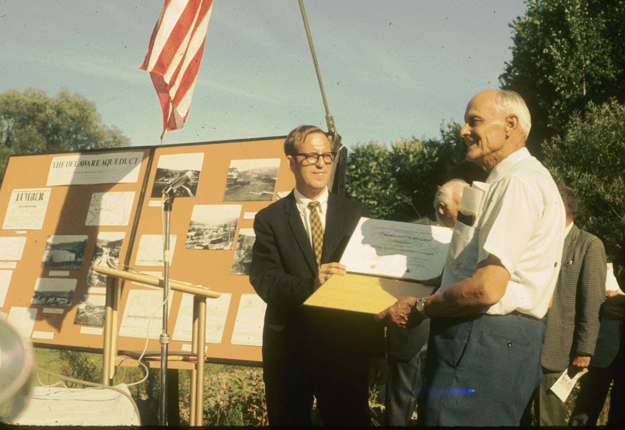 Photograph of Edward Huber accepting the National Historic Landmark…