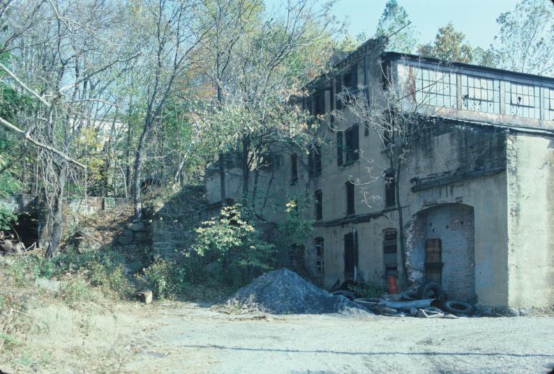 Large multi-story structure of unknown usage, built into hillside adjacent…