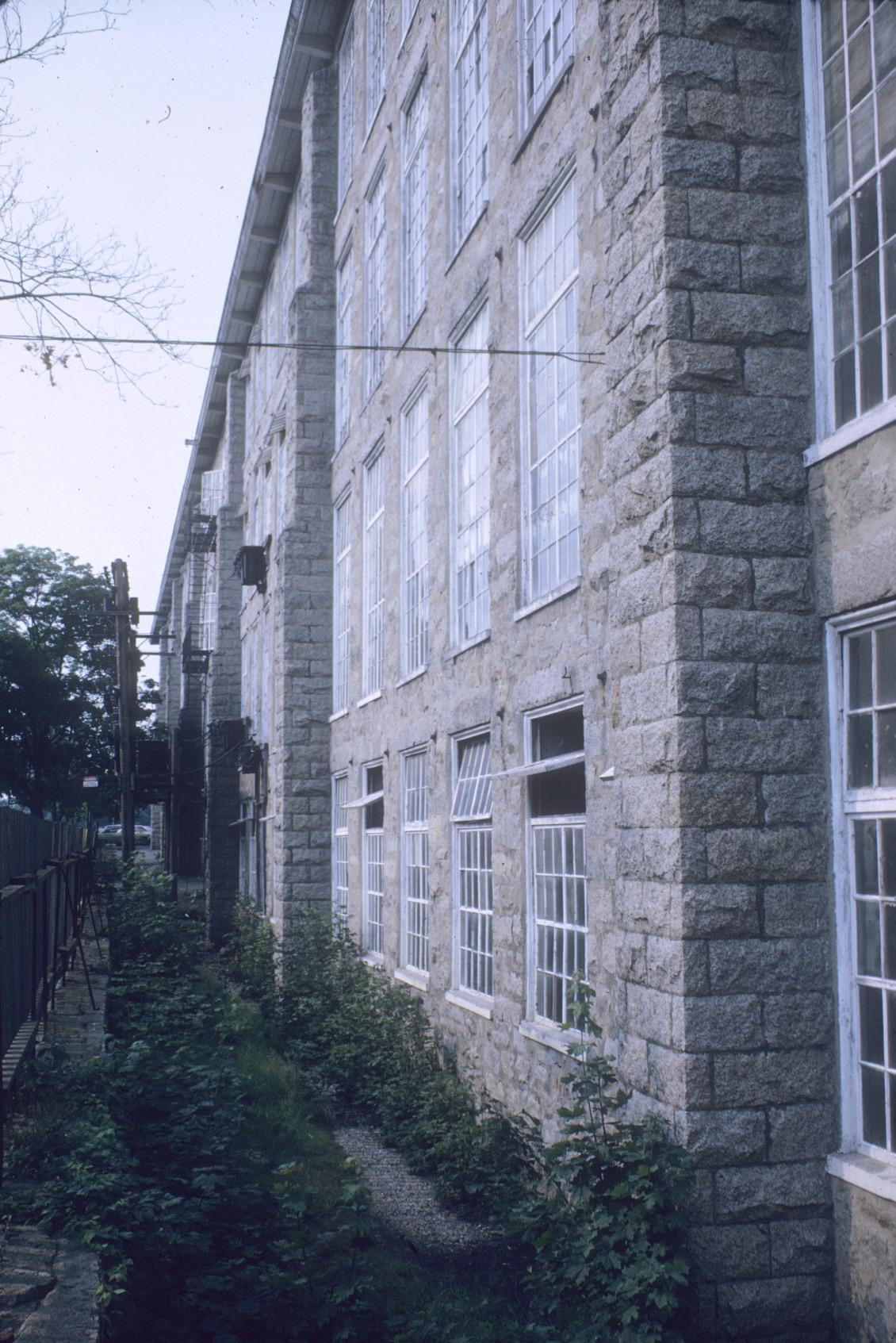 View of the buttresses of the Cornell Mill in Fall River, MA.  