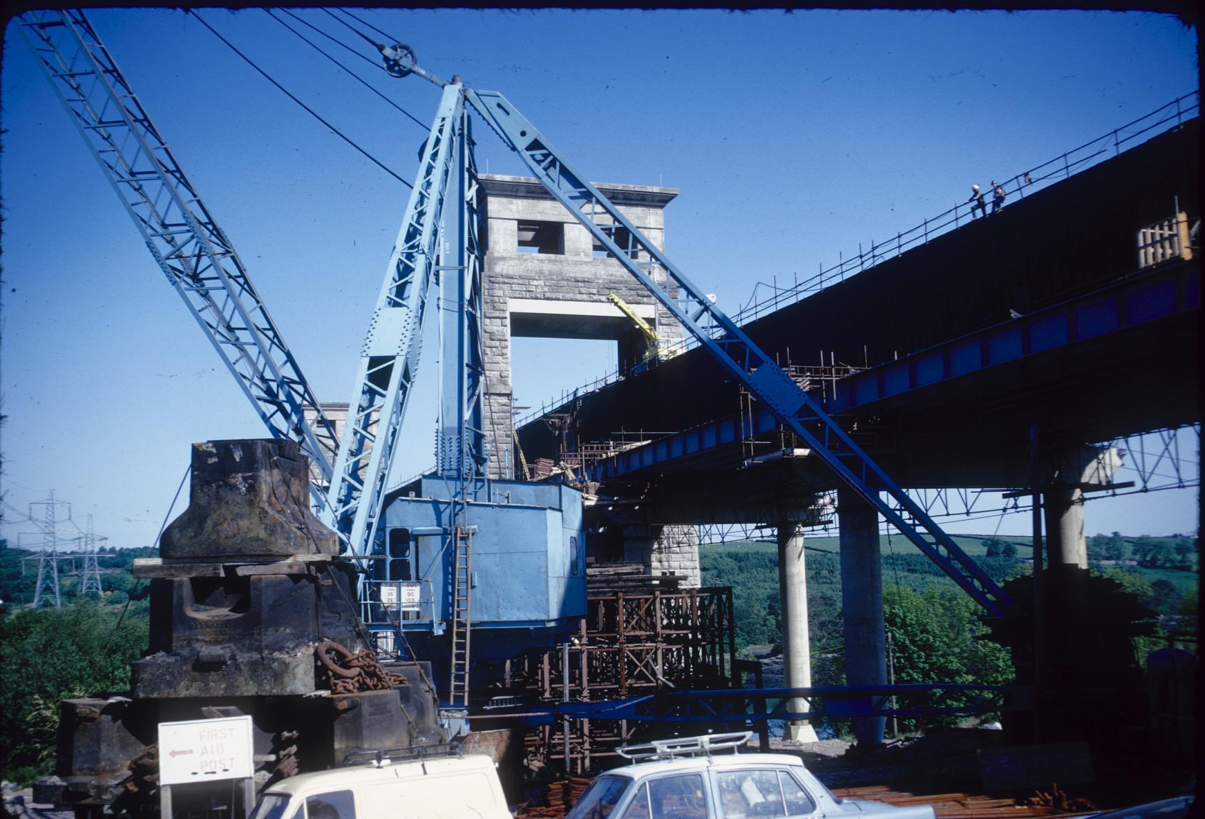 View of construction crane alongside bridge