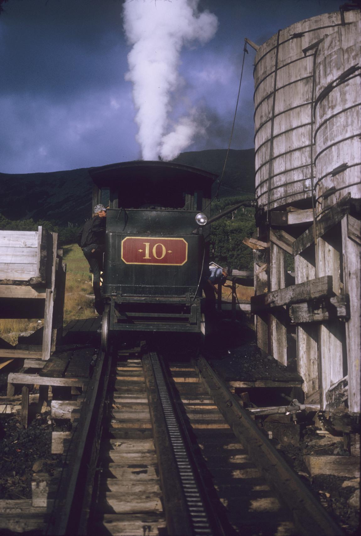 Up-train steam engine number 40 taking on water at half-way point