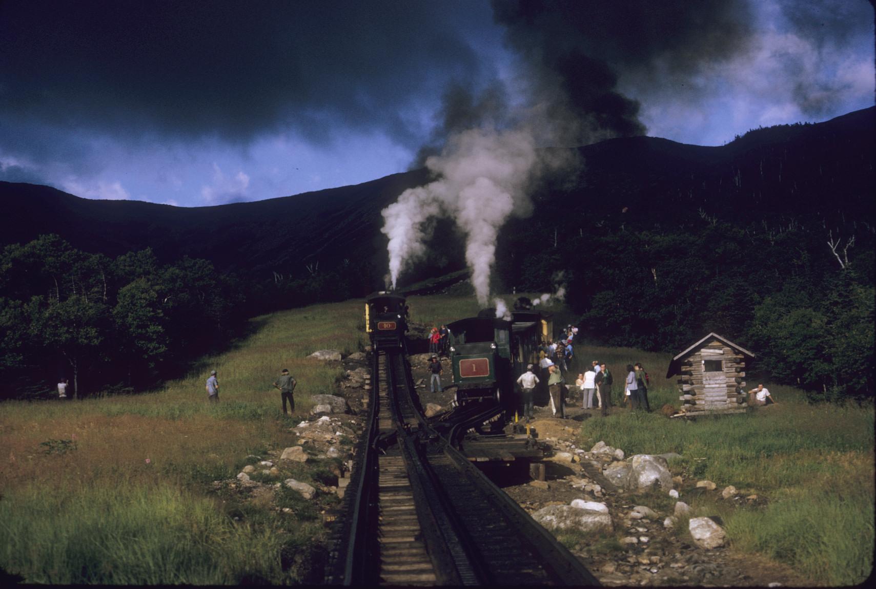 Ascending and descending trains passing at half-way point