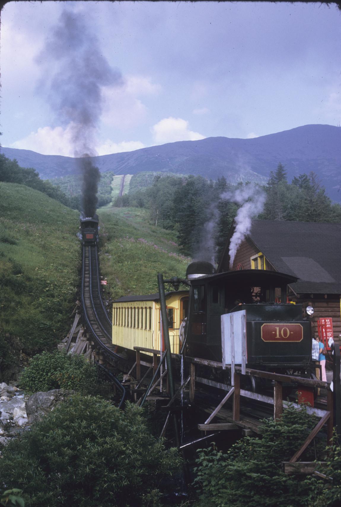 Train at Base station with second train on slope