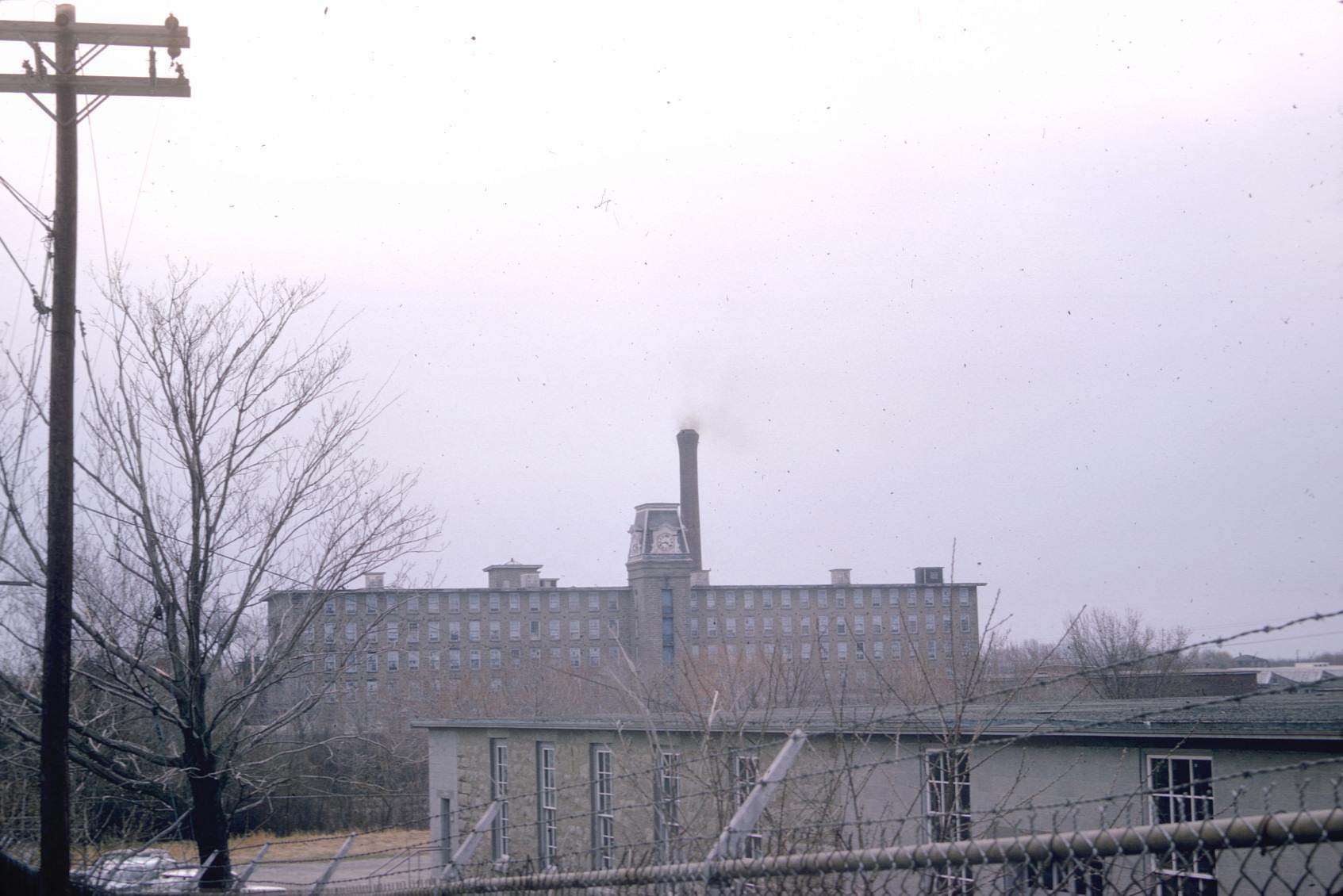 Distant view of the Bourne Mill located across the river from Fall River, MA.…