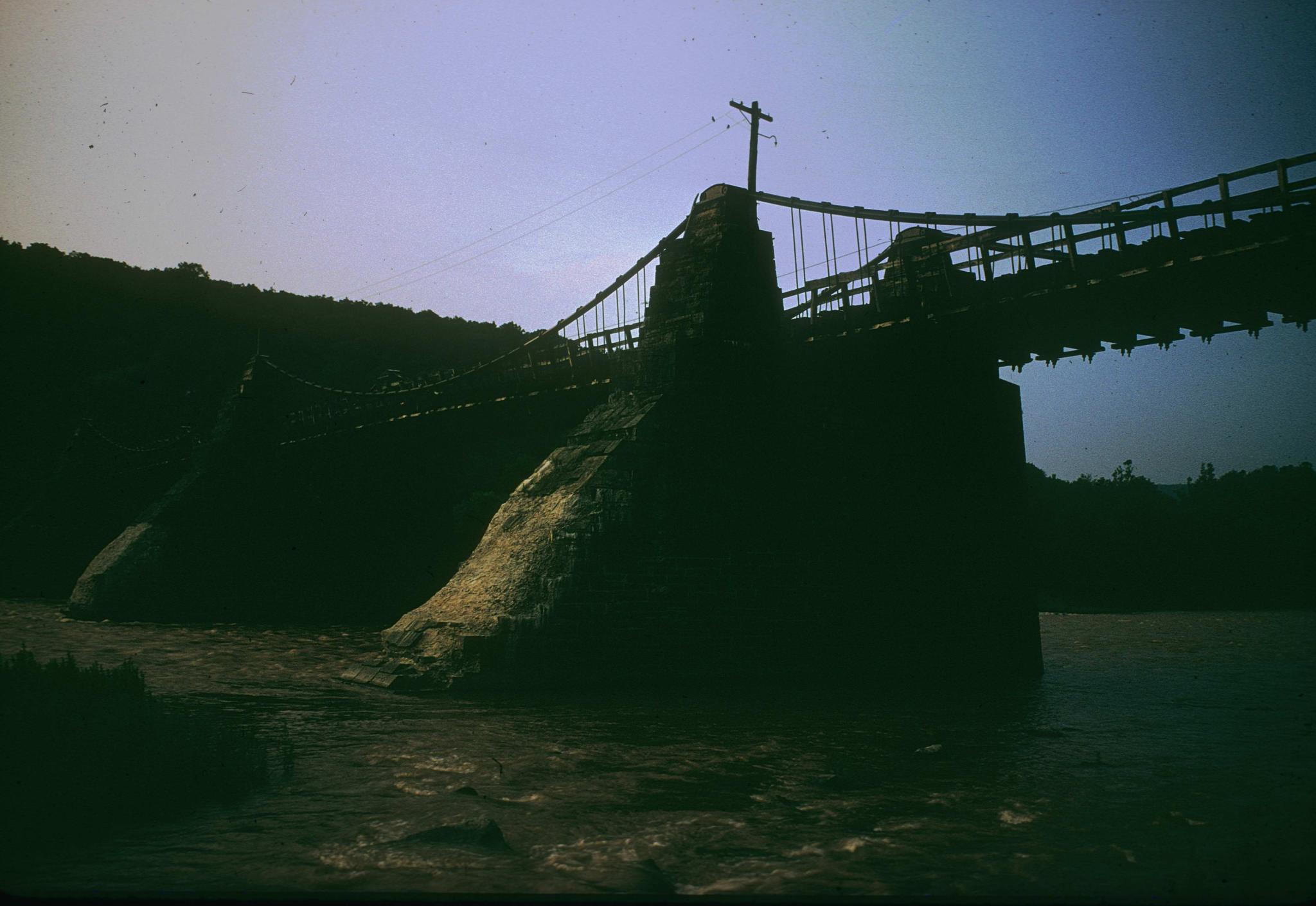 Photograph of Delaware Aqueduct, emphasizing pier, taken at dusk.The…