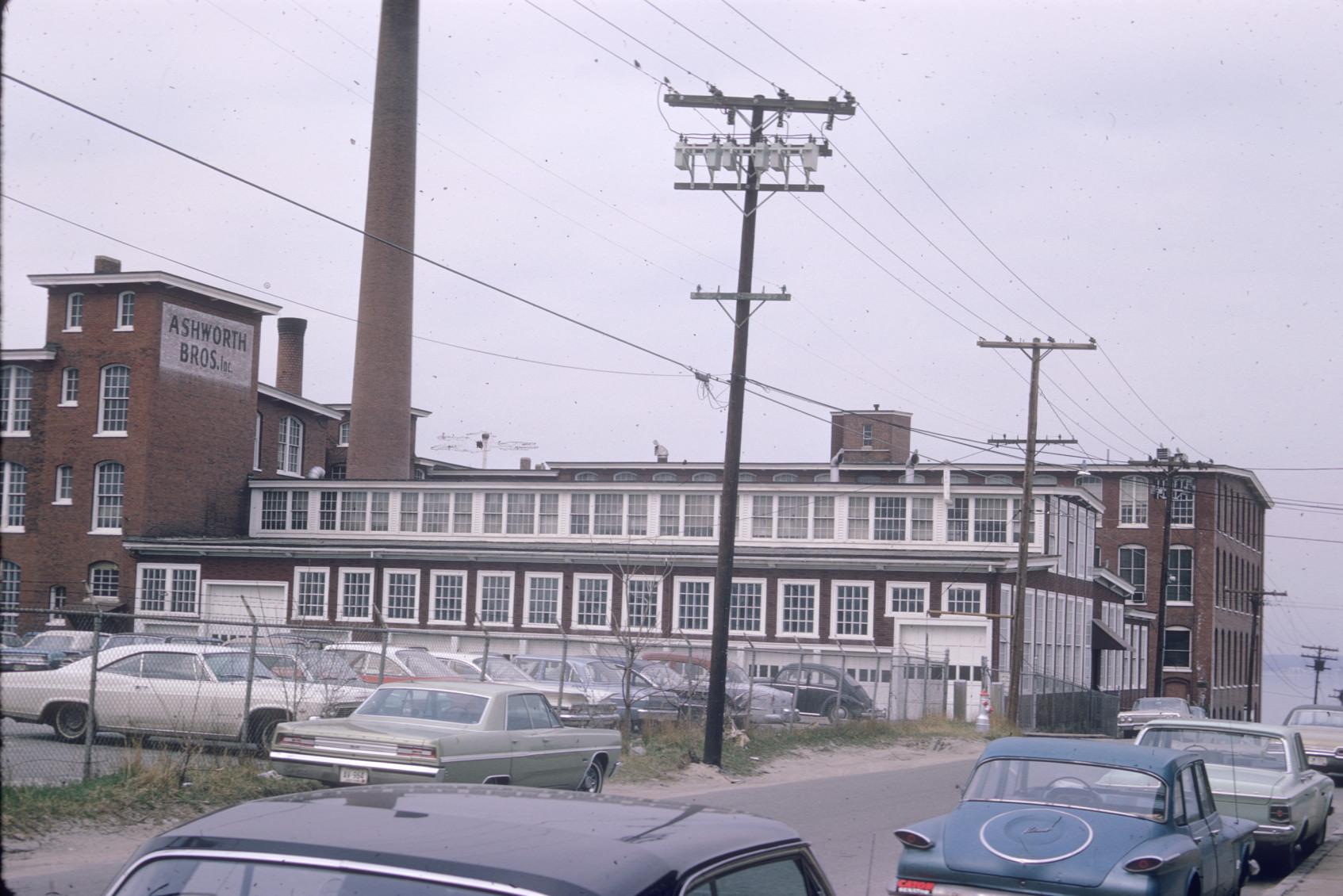 View of the Ashworth Bros. Mill complex.  Company name visible on the left as…