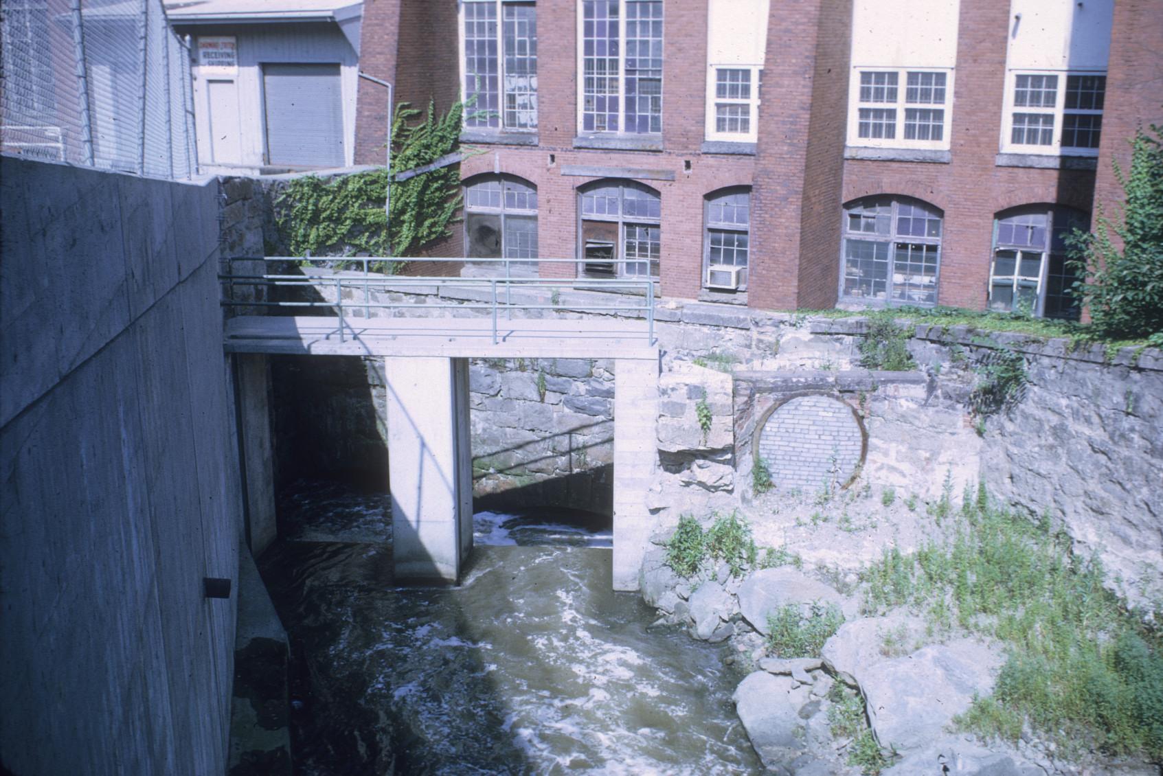 View of the head race flowing into American Print Co. Mill No. 7.