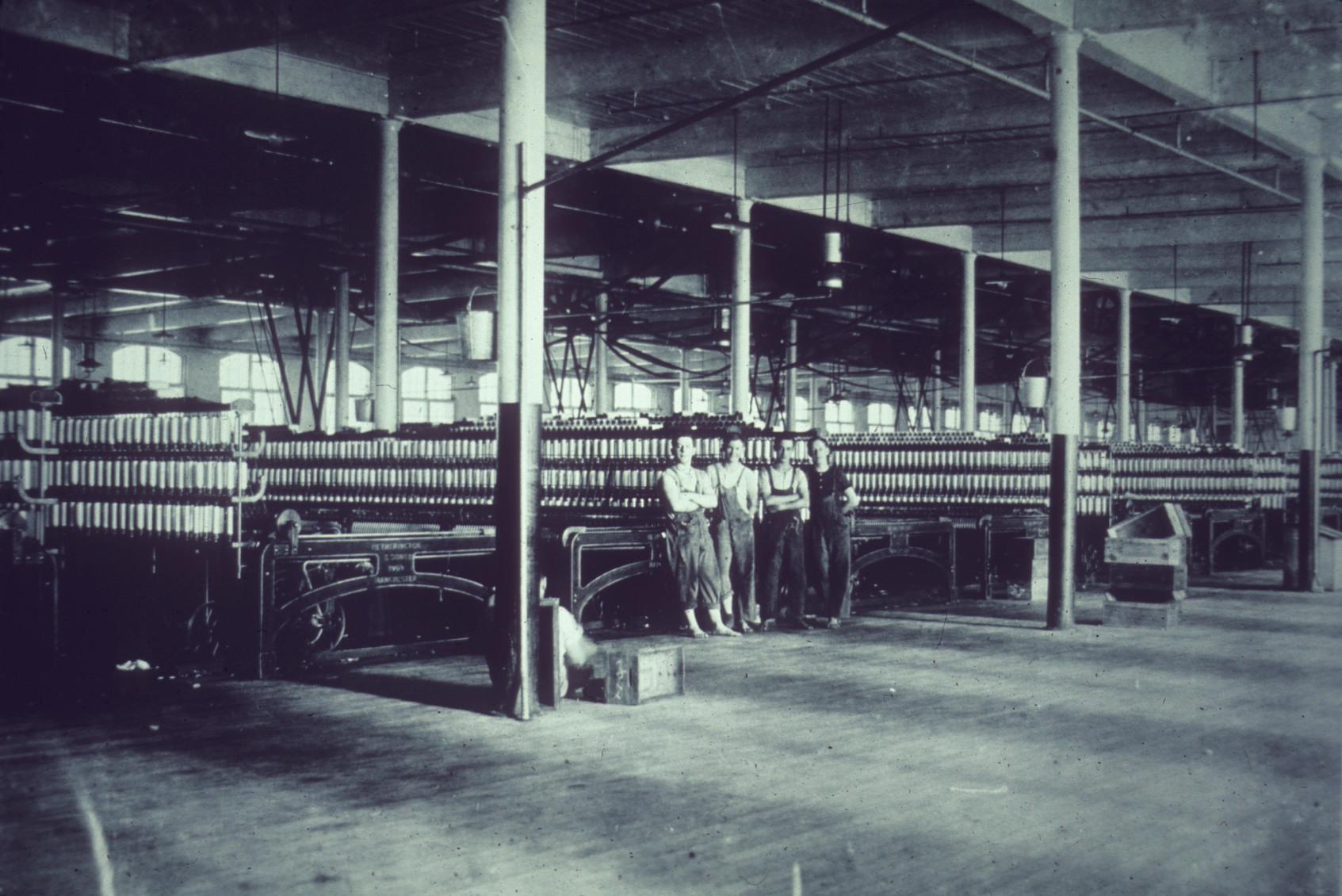 Hine photo of an unknown New Bedford textile mill's spinning room c. 1910.