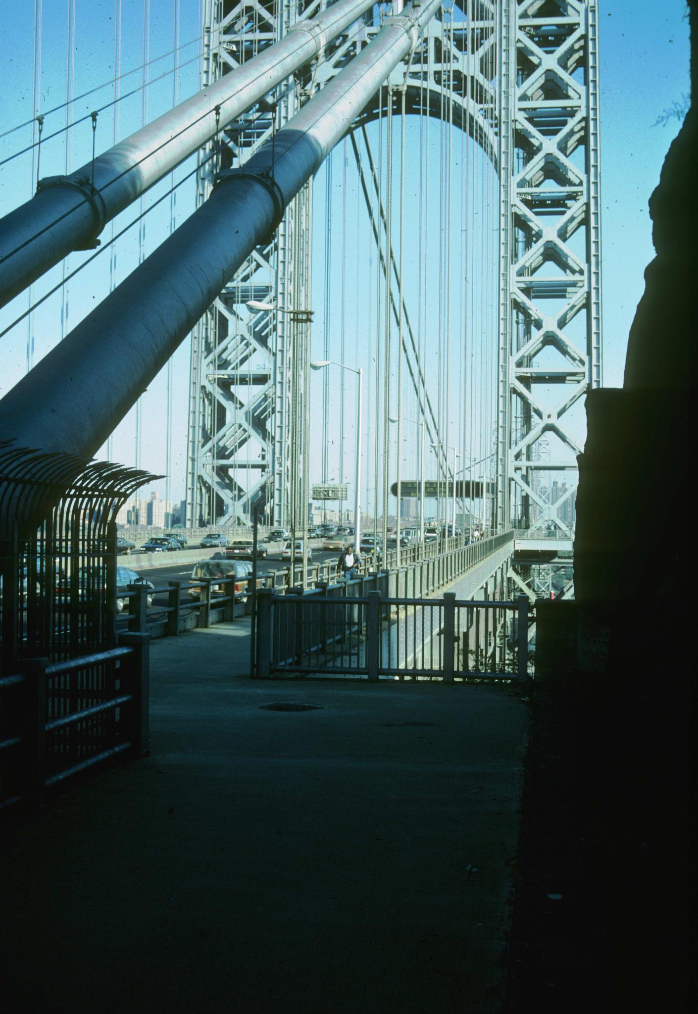 Photograph of bridge showing pedestrian entry and cables