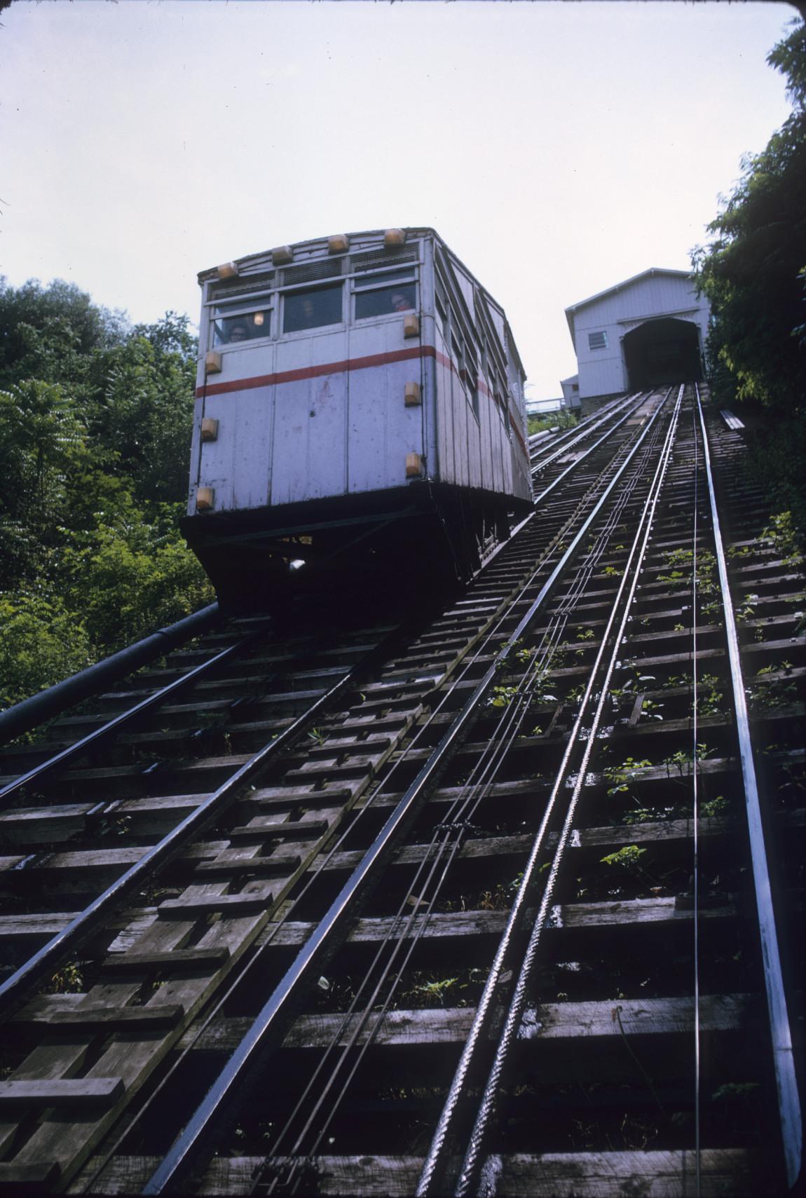 View up incline toward head station with passenger car 