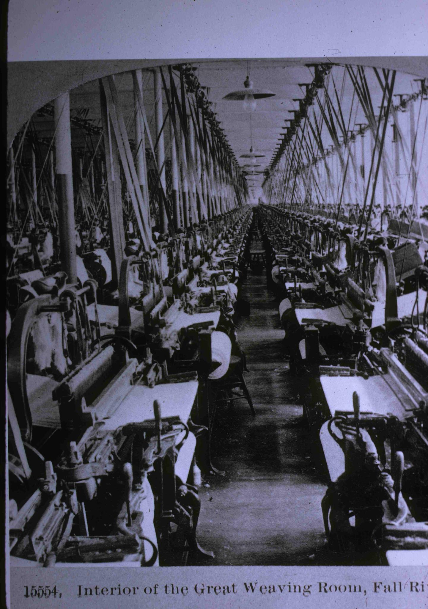 Photo from a Fall River textile mill weaving room c. 1911.  Belting visible.