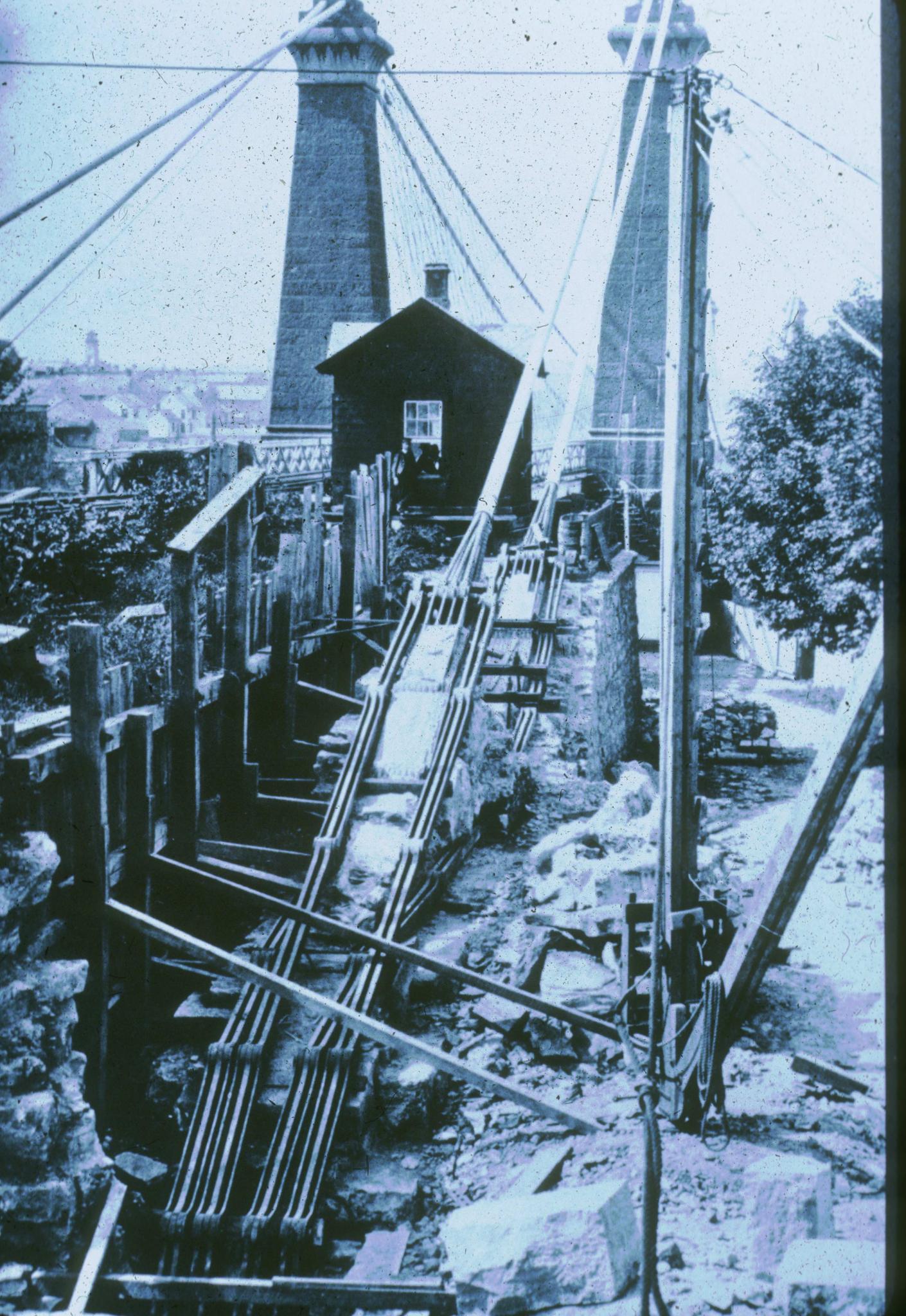 Historic photograph of repairs to the eyebars of the Niagara Railroad…