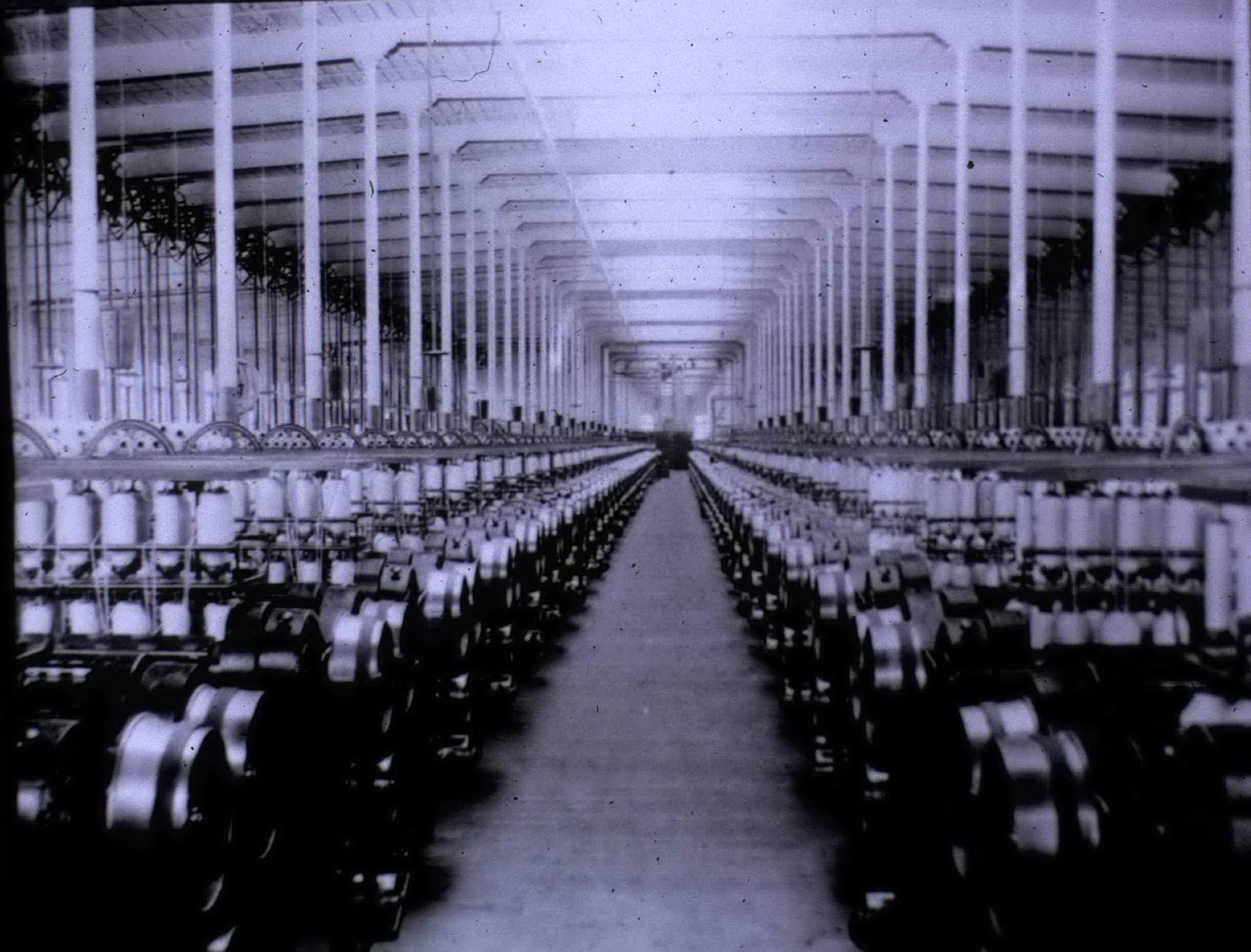 Old photo of an interior of a weaving room in Fall River, MA. 