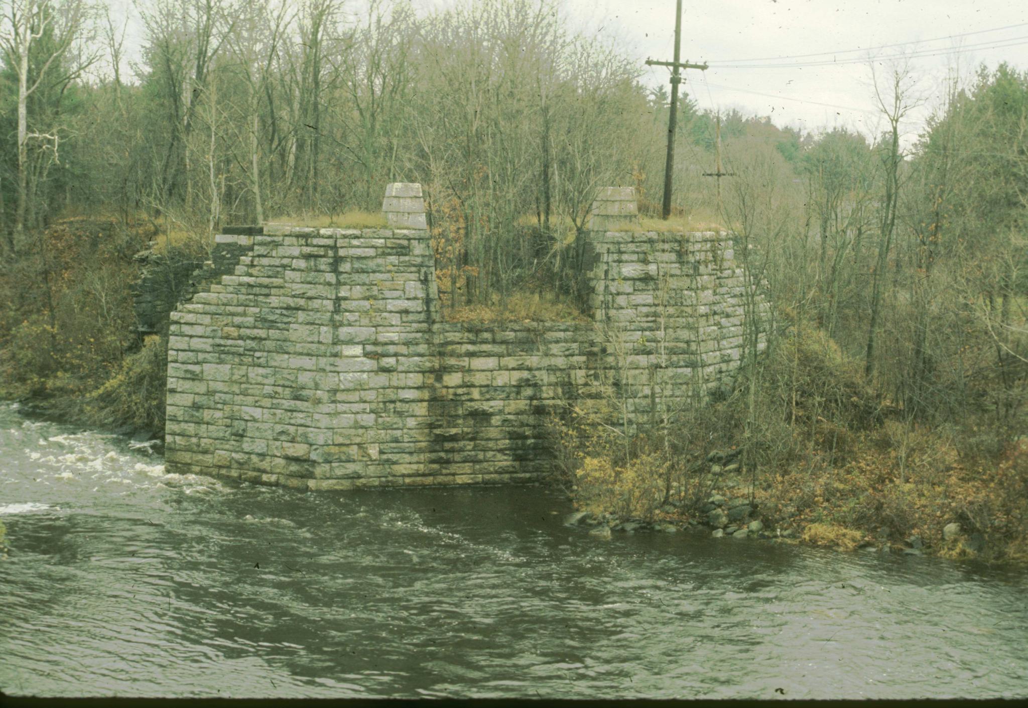 Photograph of an abutment of the Neversink Aqueduct.The Neversink Aqueduct…