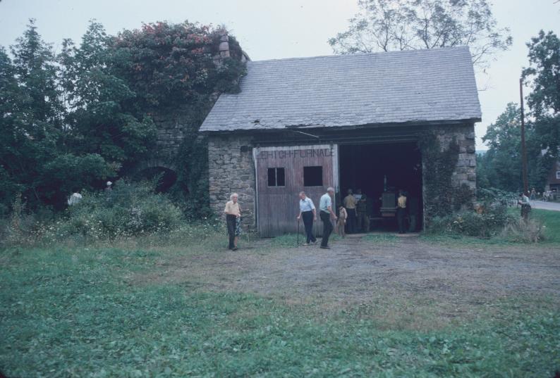 View of stone work shelter with adjacent iron furnace SIA tour 1974