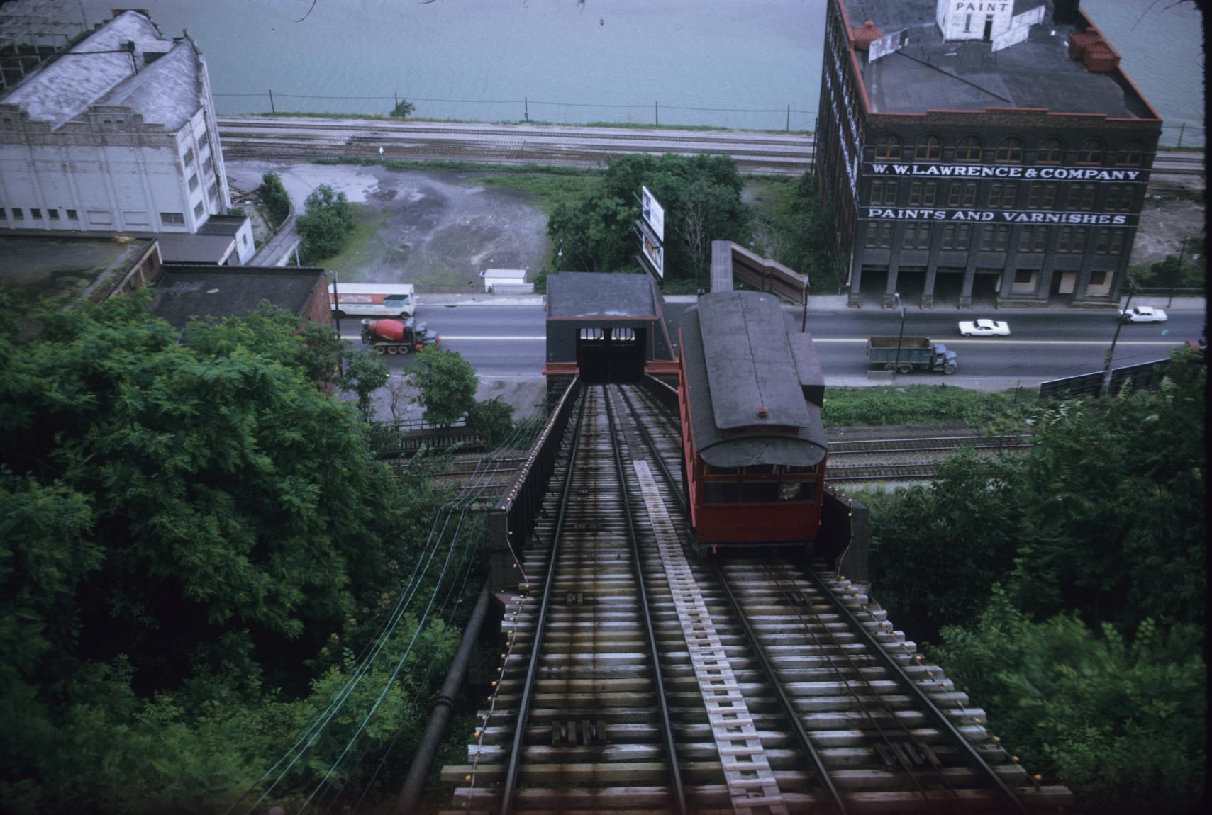 View down incline plane from mid-slope; view of alternate car and Bottom station