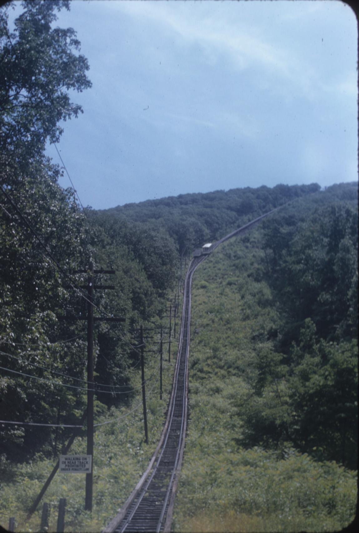 General view of incline track with cars passing at mid-point