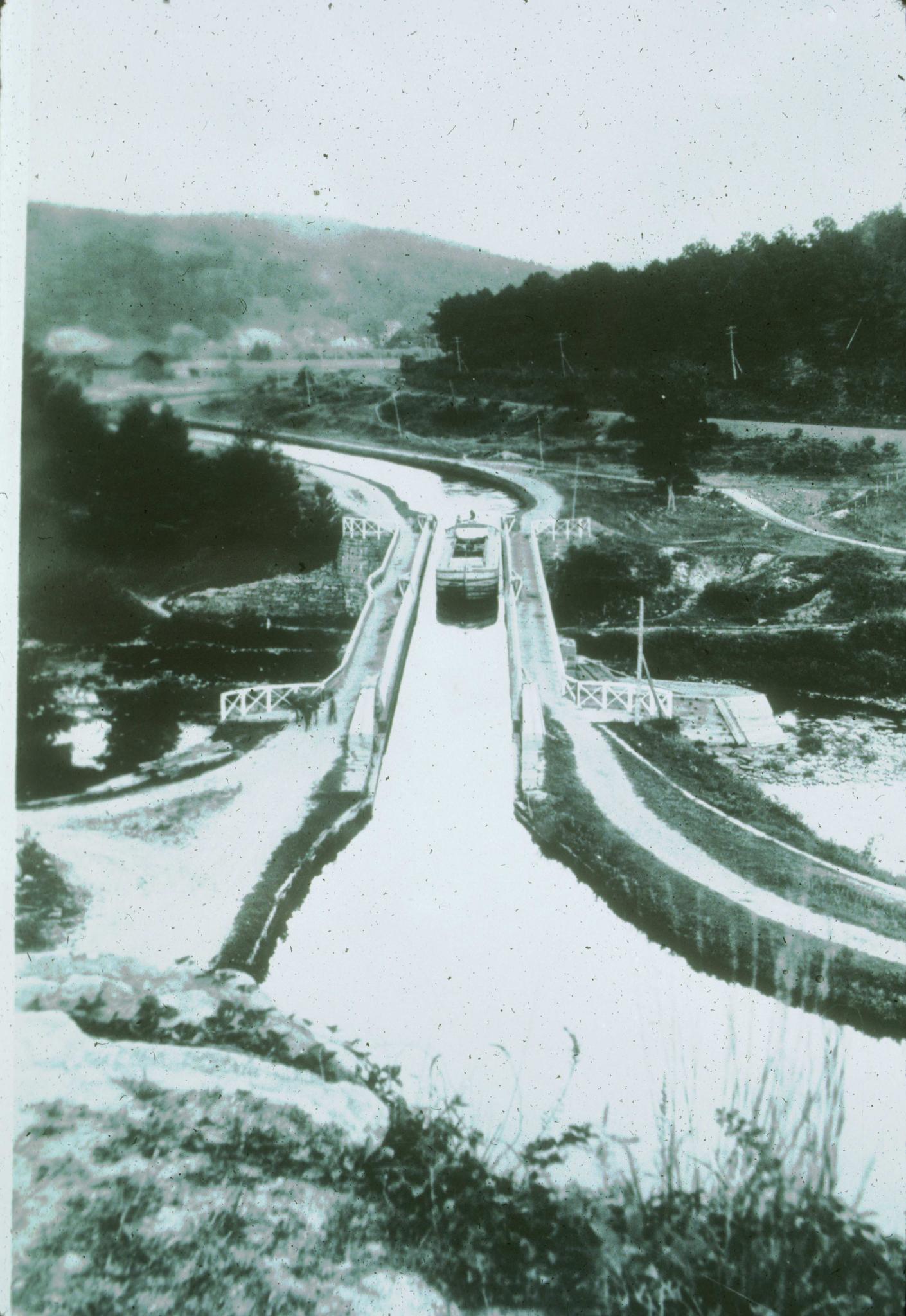 Historic photograph of the Lackawaxen Aqueduct circa. 1890 showing a barge in…