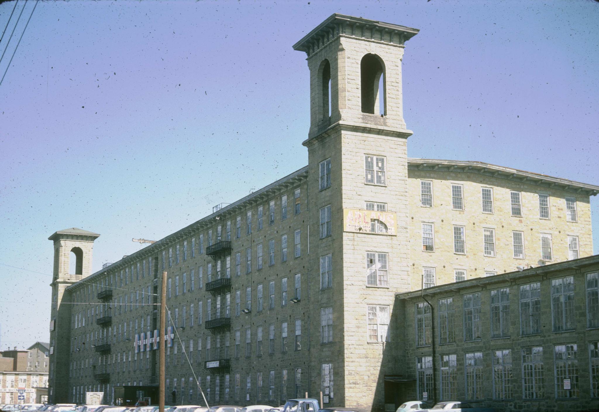 Photograph of the mill building taken from the parking lot.