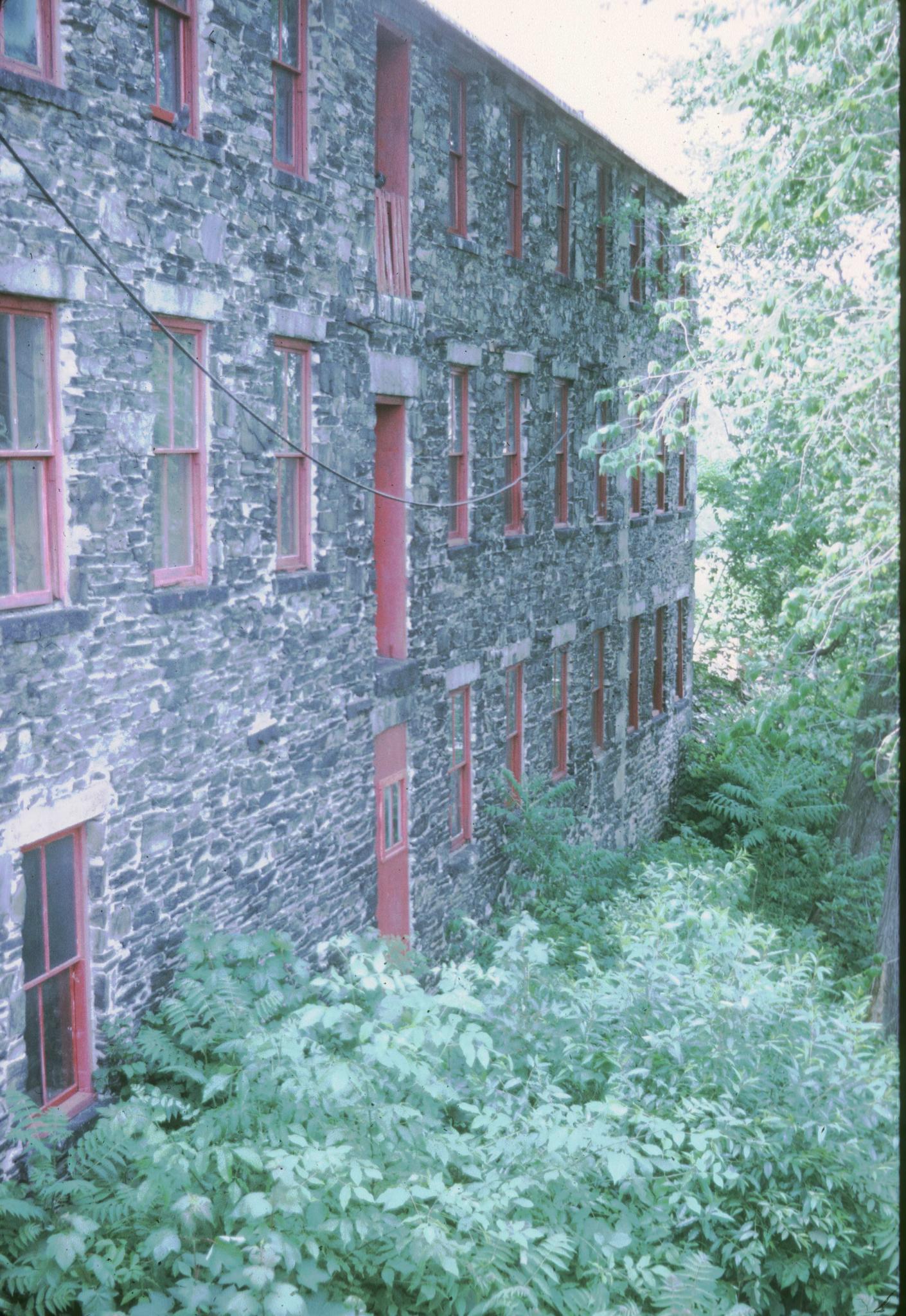 Unidentified textile mill on the Concord River at Lowell, Massachusetts.  