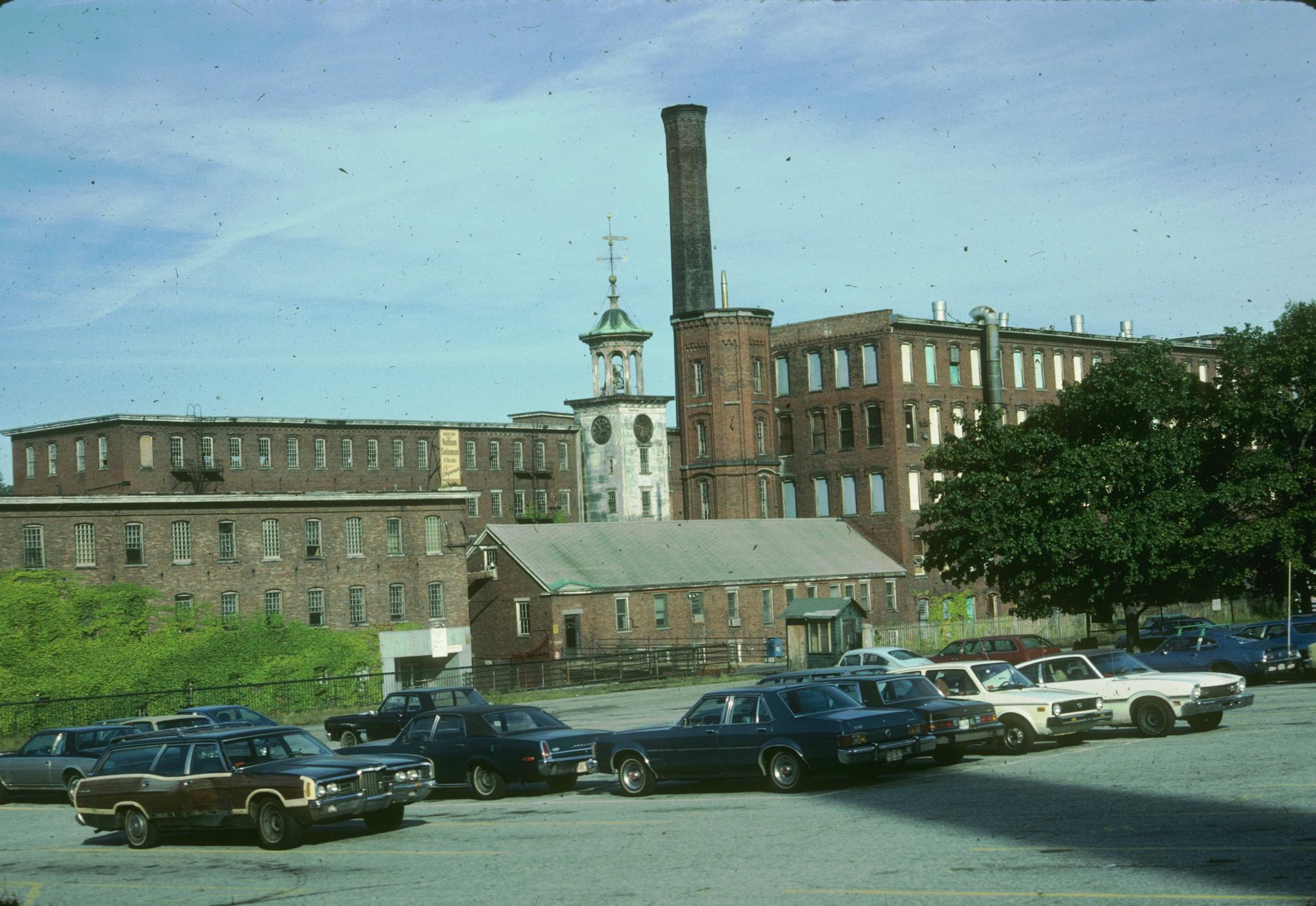 Photograph of the mill taken from a parking lot.