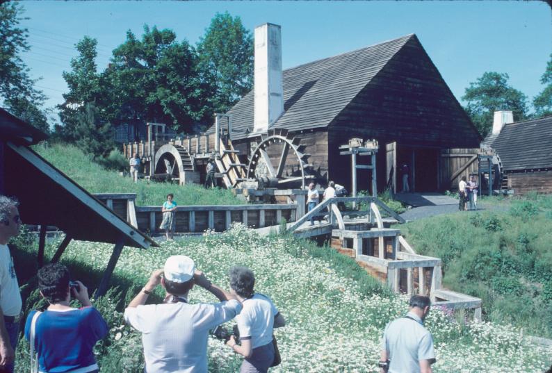 General view approaching forge building (reconstructed) showing three water…