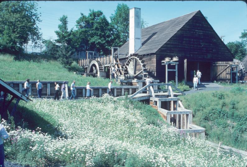 General view approaching forge building (reconstructed) showing three water…