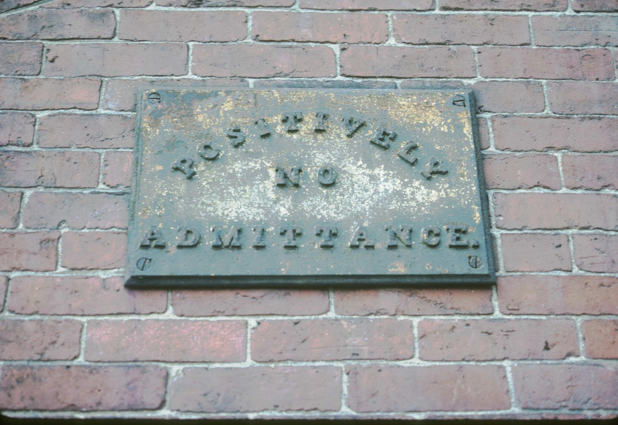 Photograph of an iron sign "POSITIVELY NO ADMITTANCE"