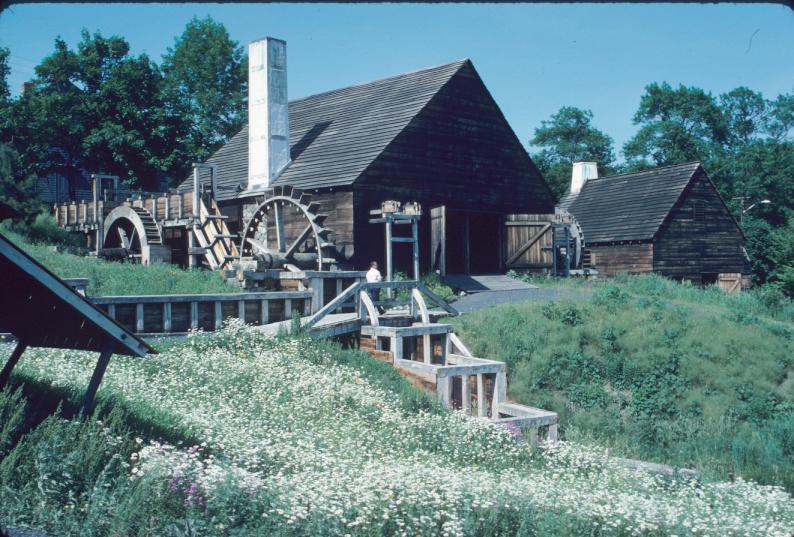 General view approaching forge building (reconstructed) showing three water…