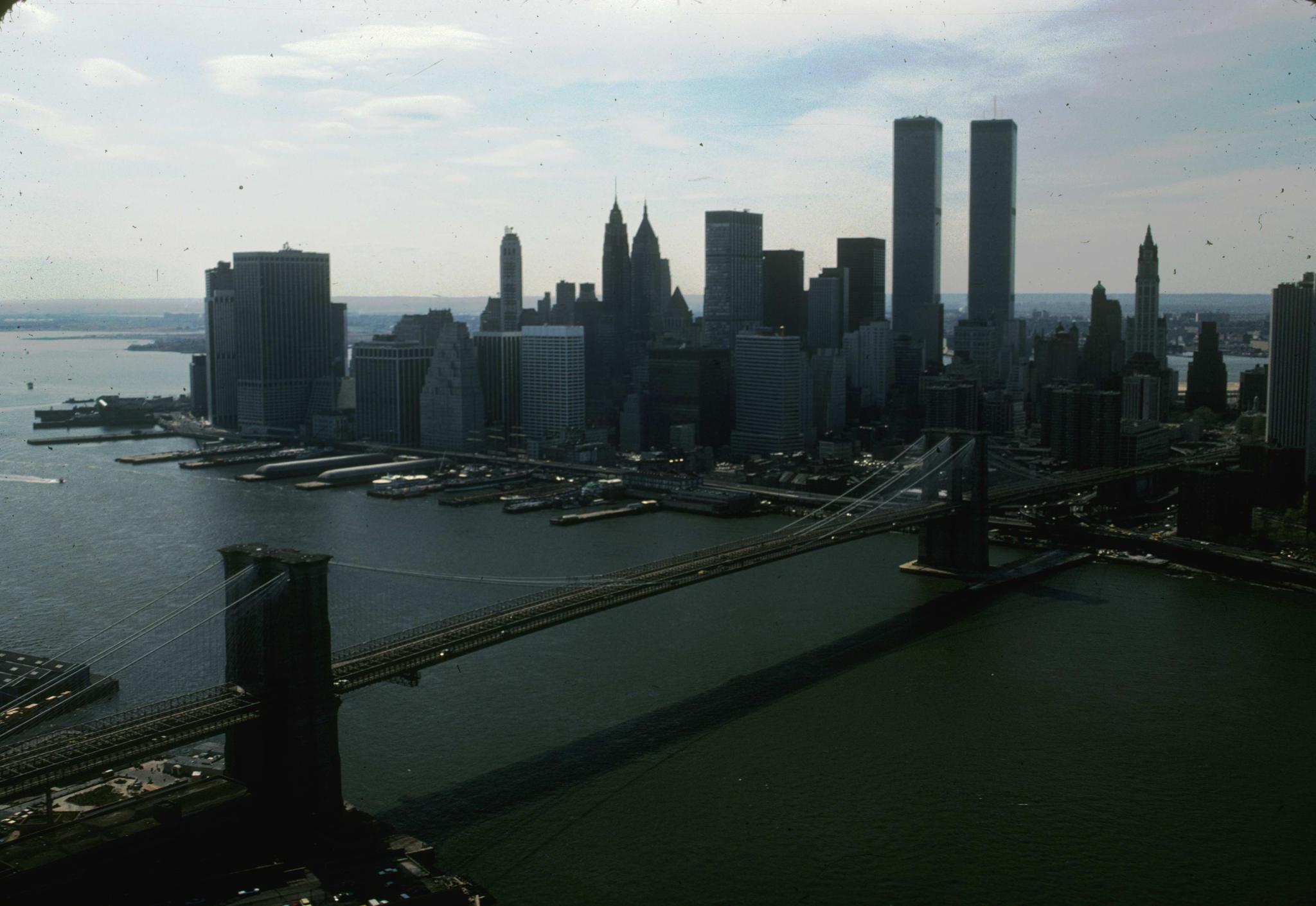 Photograph of Brooklyn Bridge from the air.  Manhattan is in the background…