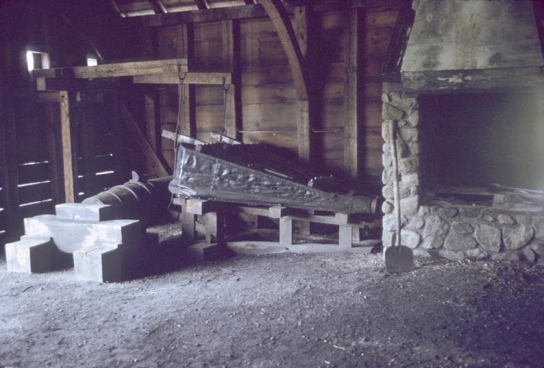 Interior of forge showing hearth anf air bellows