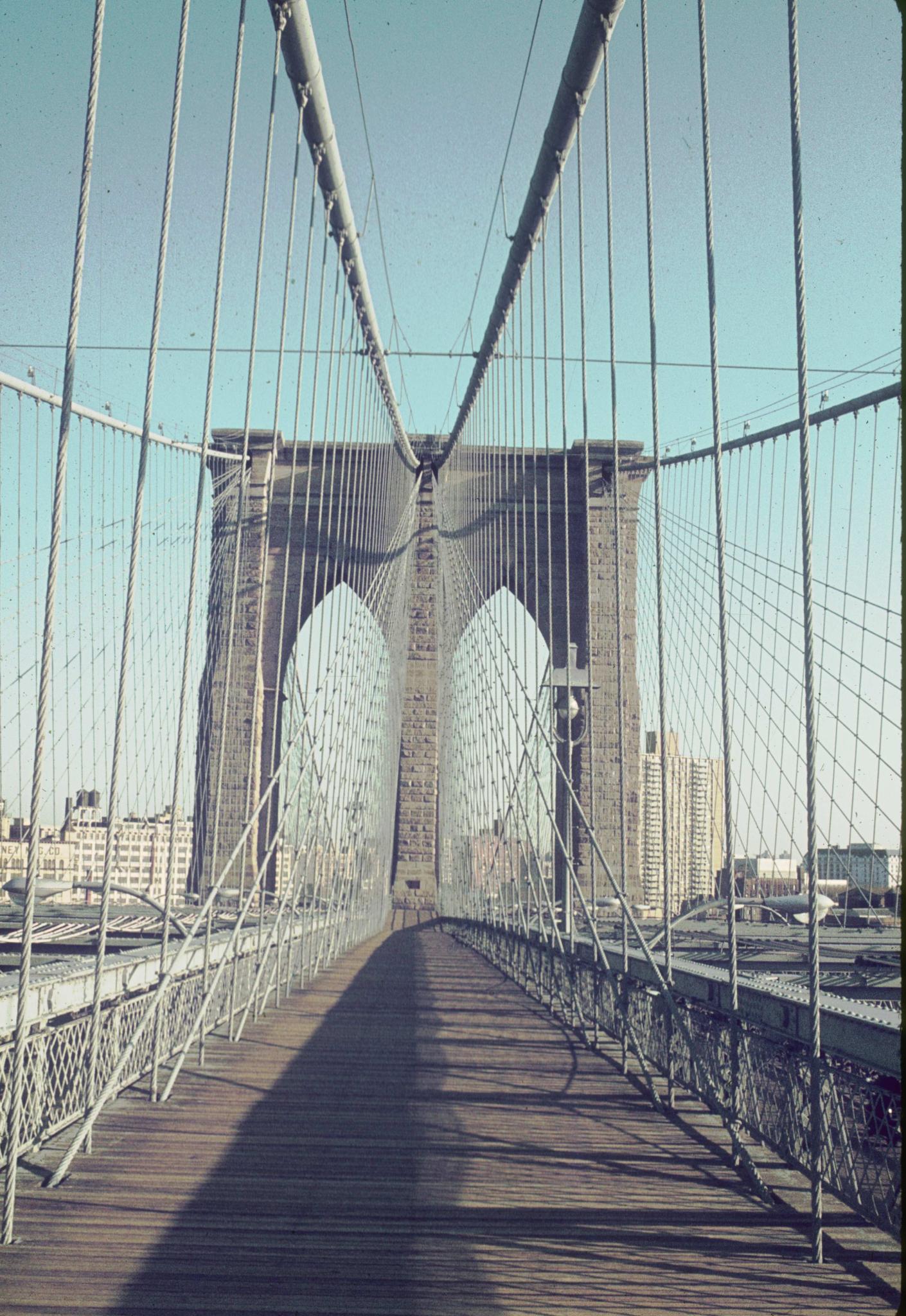 Photograph of the Brooklyn Bridge prominade.Possible initials (PMV?, PMW?)