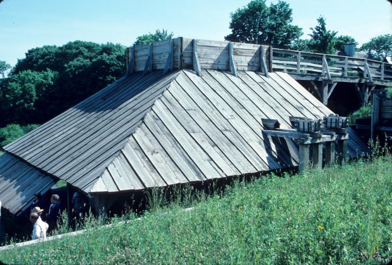 Roof over furnace and bridge to charging deck