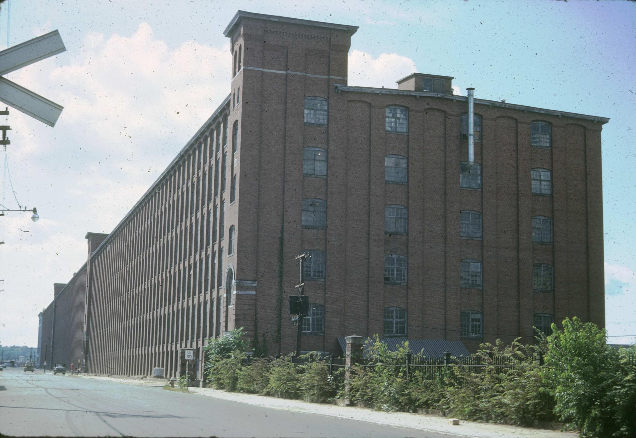 Photograph down the street front of the mill.