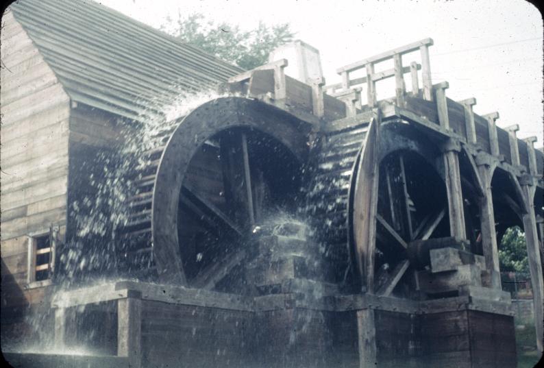 Overshot water wheels in opeartion, adjacent rolling/slitting mill