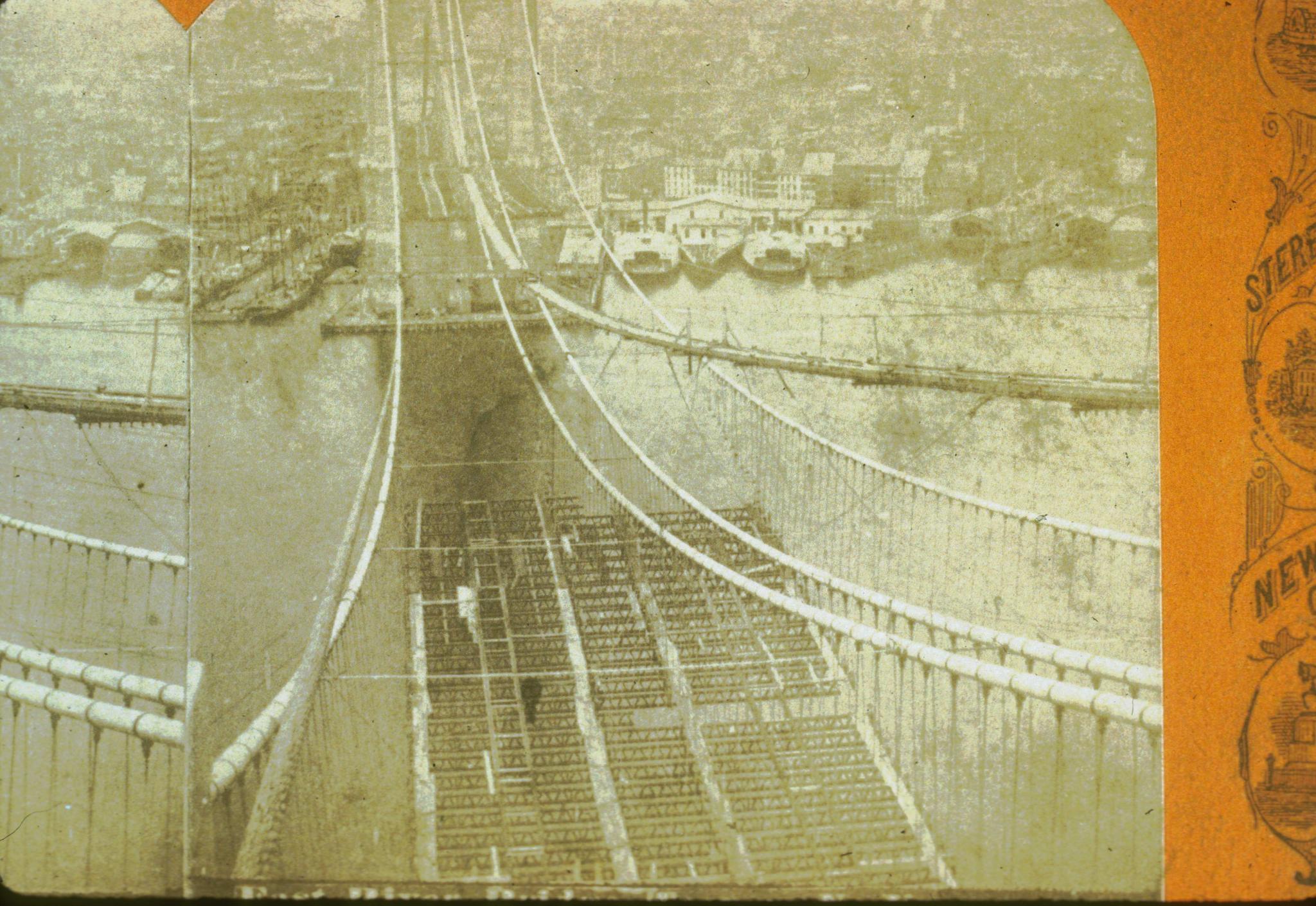 Historic photograph of floor beams on the bridge being placed circa 1881.…