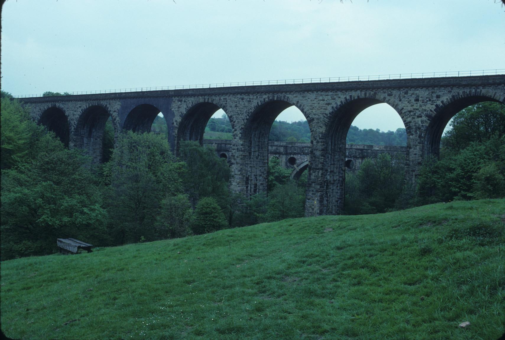 View of Marple aqueduct through arches of adjacent railroad viaduct