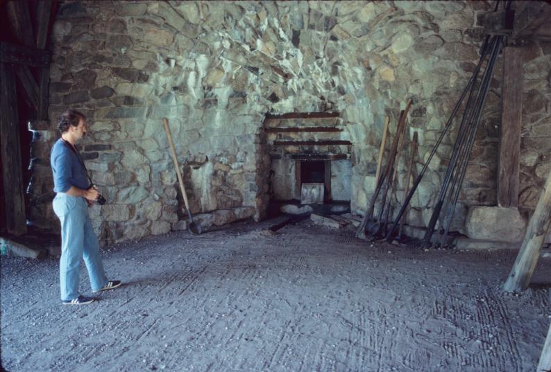 Interior view showing hearth at base of blast furnace, miscallaneous tools