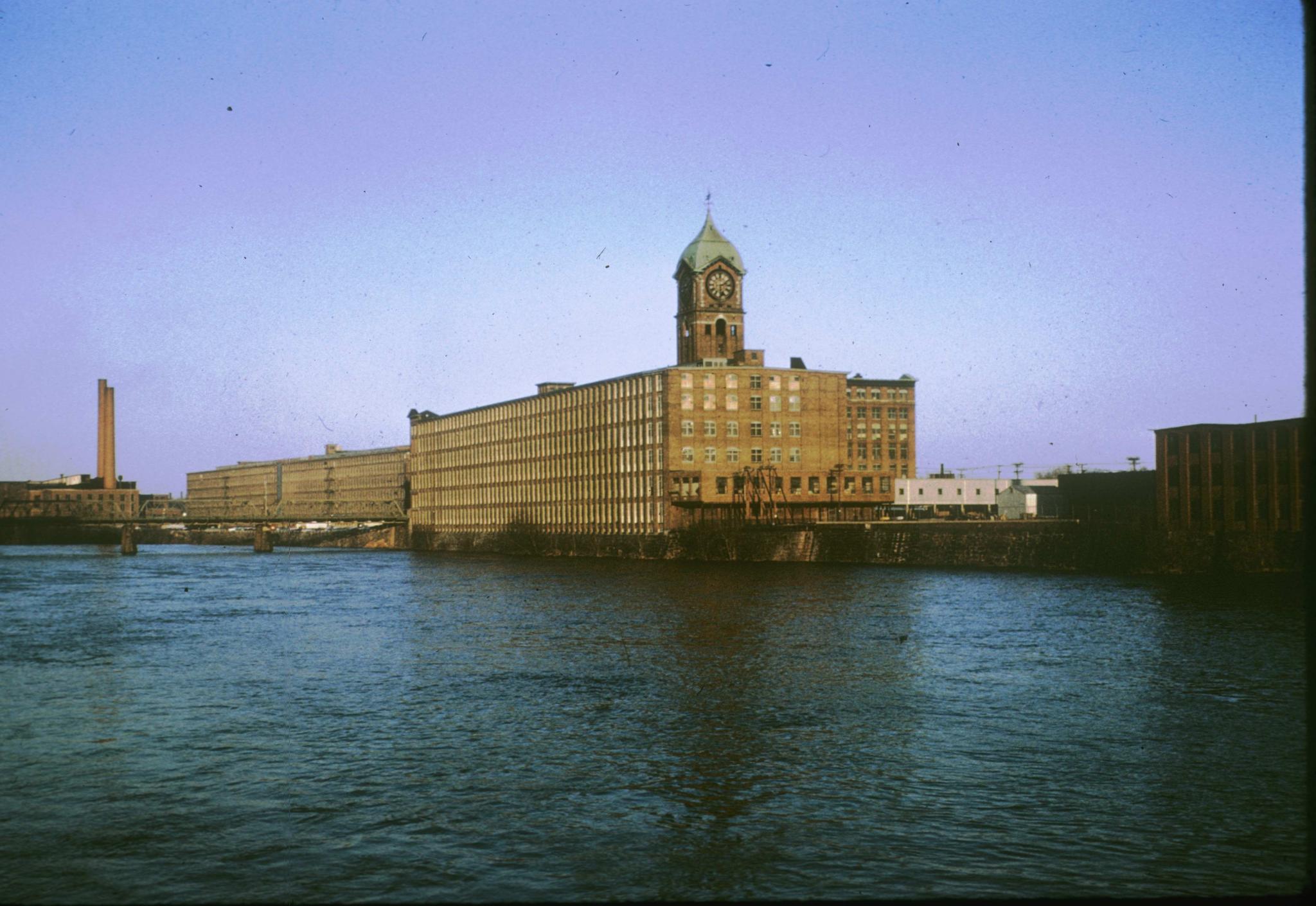 Photograph of the Ayer Mill from the northwest with the Merrimack River in the…