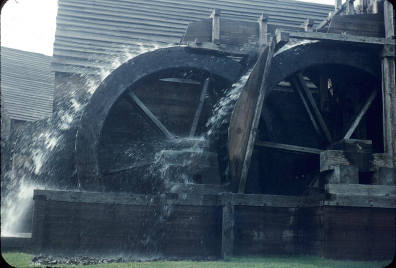 Overshot water wheels in operation next to rolling/slitting mill