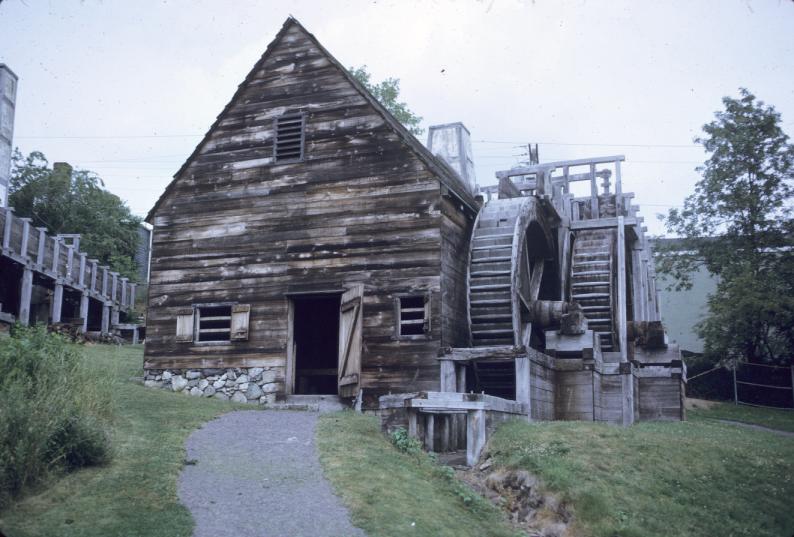 View of entrance to rolling mill with adjacent overshot water wheels