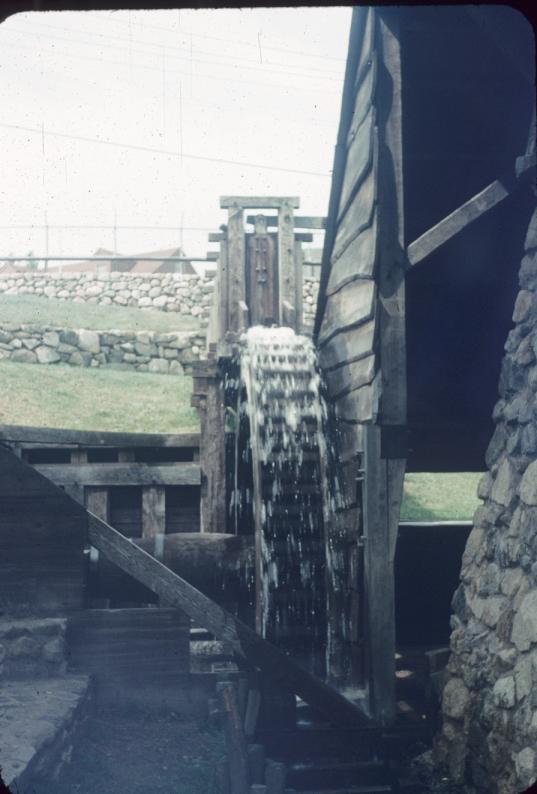 Overshot water wheel in opearation at blast furnace