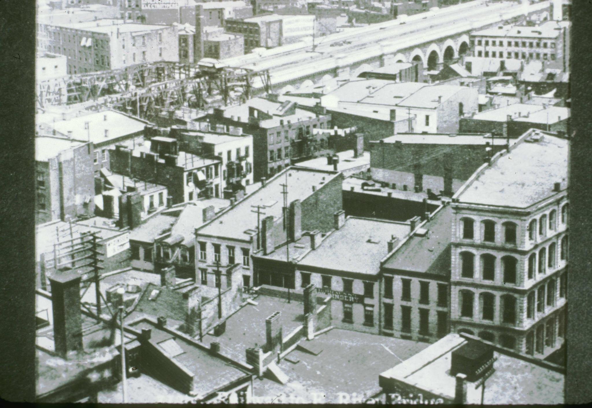 Historic photograph of the approach to Brooklyn Bridge from the New York side…