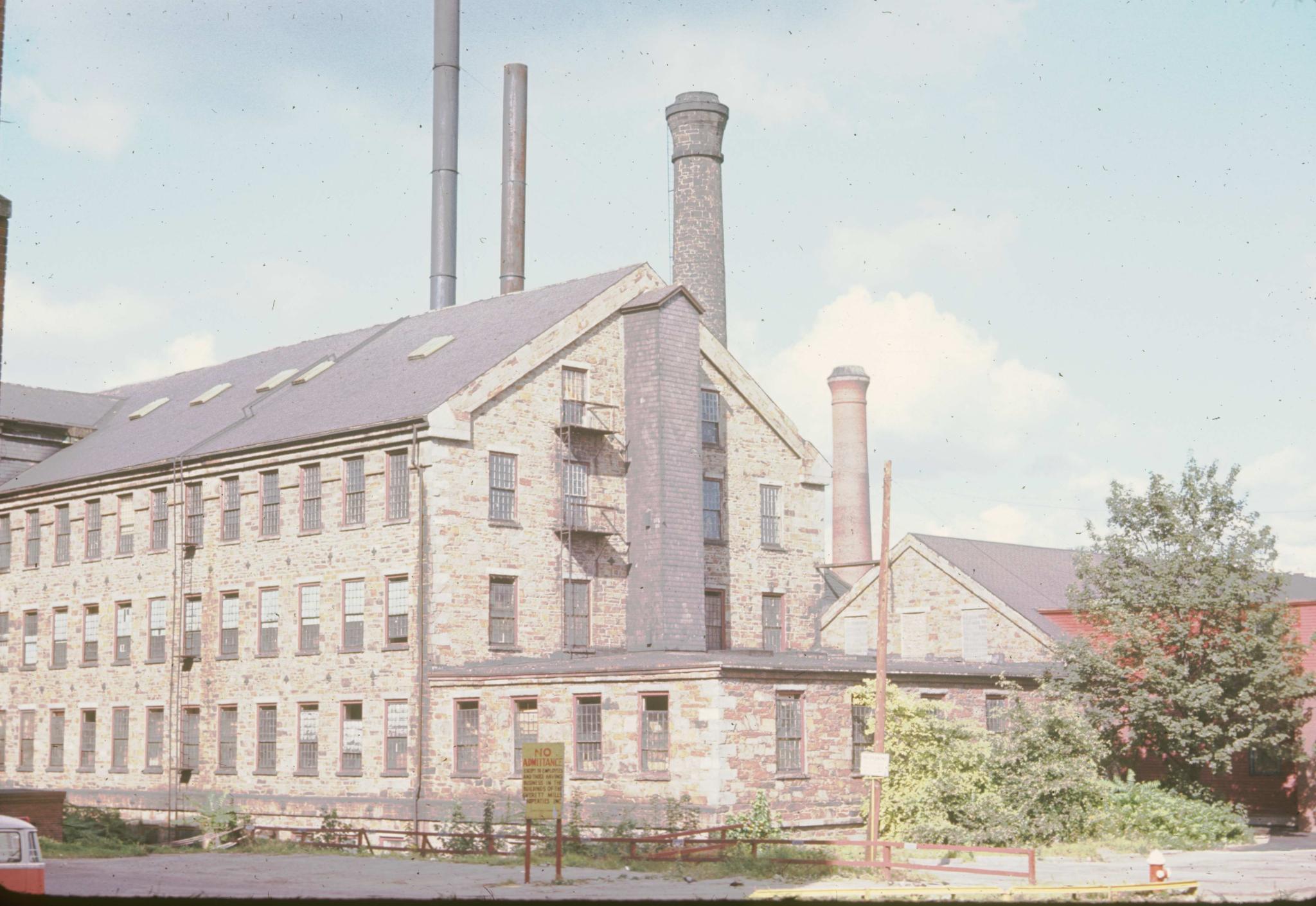 Photograph of the south end of an unidentified 1846 machine shop in Lawrence,…