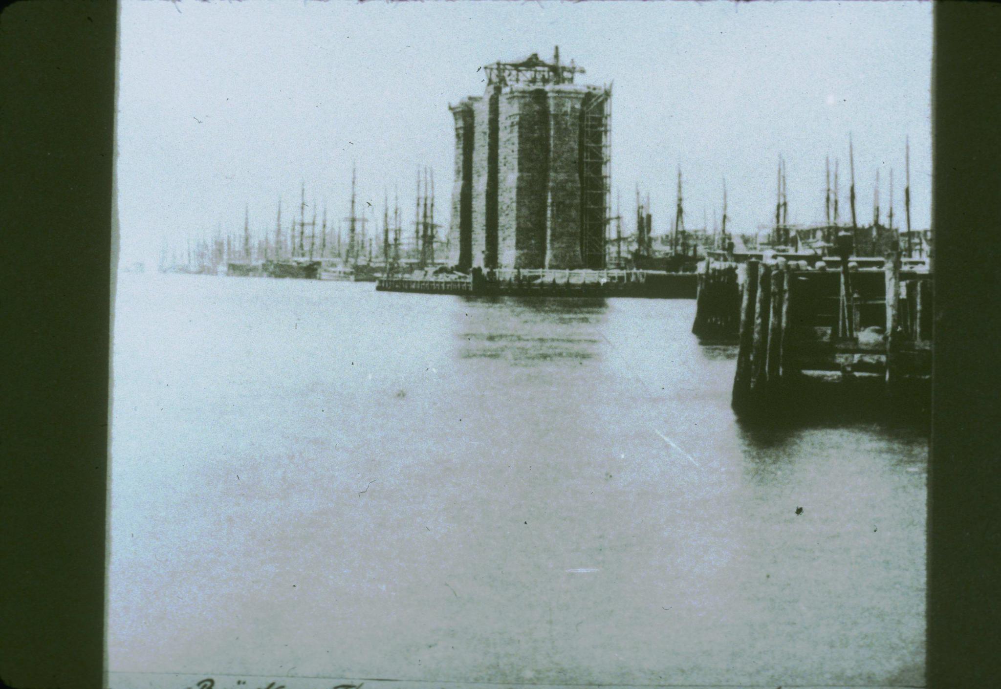 Undated historic photograph showing a tower of the Brooklyn Bridge under…