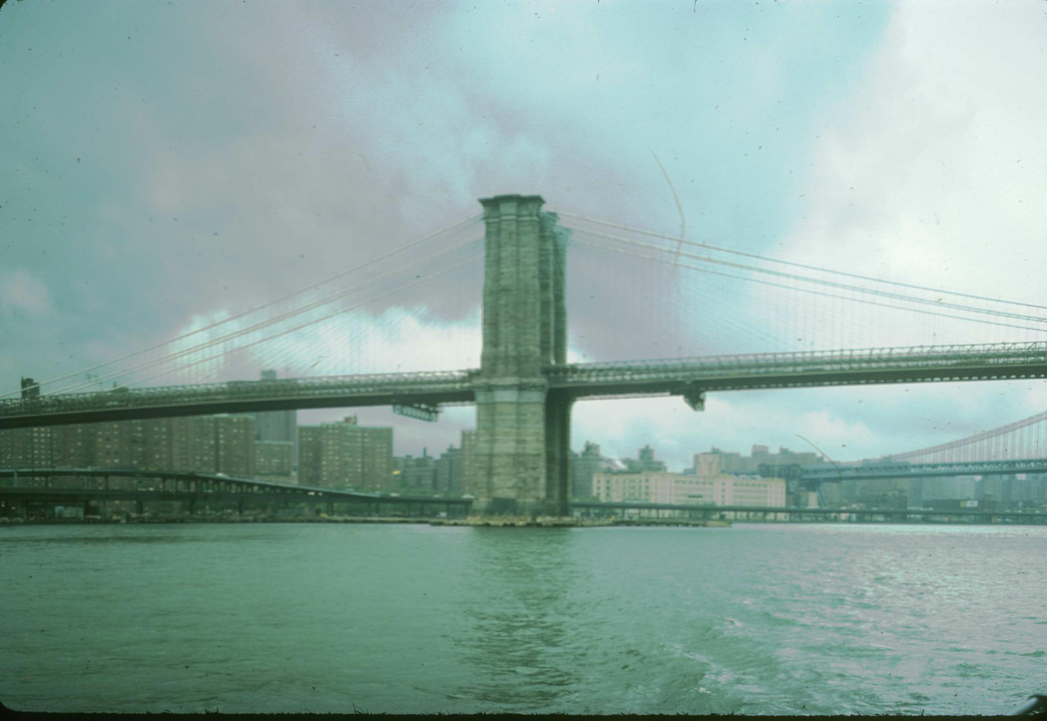 Photograph of Brooklyn Bridge focused on one tower.  Photograph attributed to…